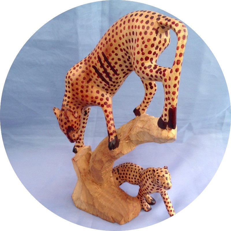 Hand carved Leopard climbing tree